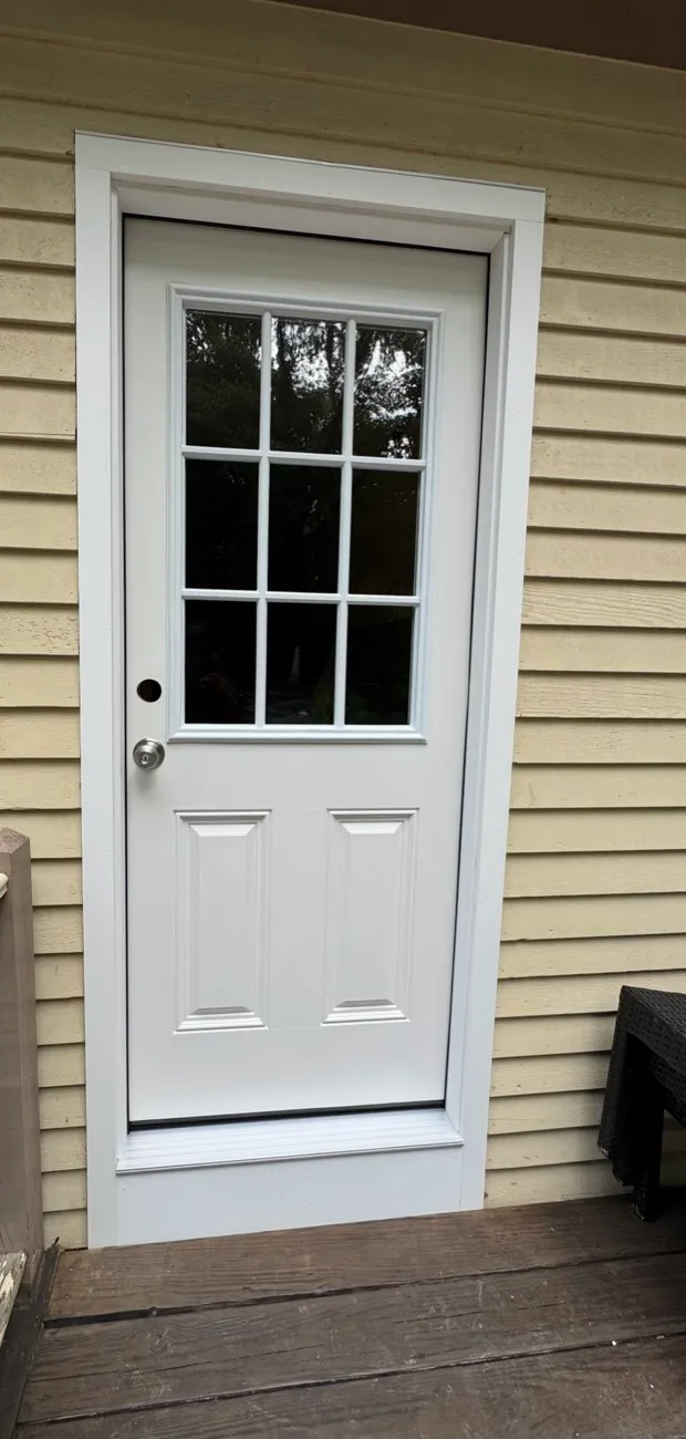 New white entry door with clean trim