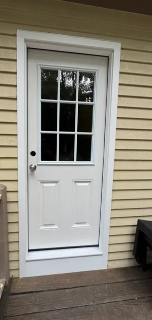 New white entry door with clean trim
