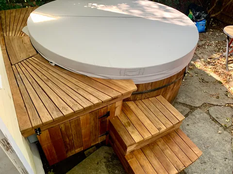 Custom deck and sunrise-shaped staircase built from reclaimed teak