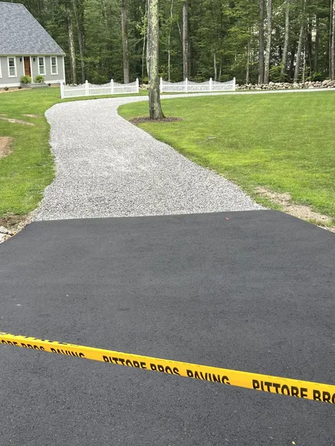 Gravel driveway prepared for new asphalt paving