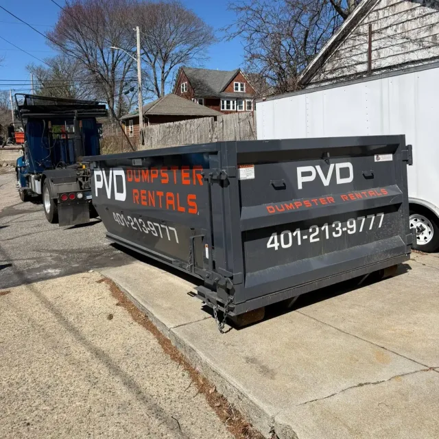 15 yard roll-off dumpster dropped at the curb