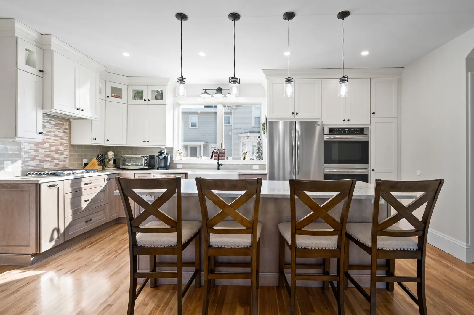 White shaker kitchen with island seating