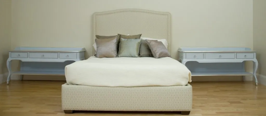 Large nightstands for a very long wall in a master suite. Designed by Ron Bento. Paint finish with Silver metal leaf