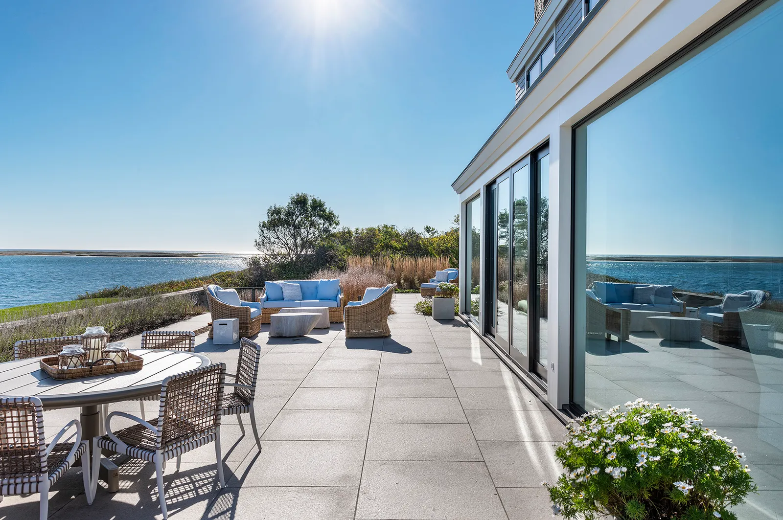 Coastal granite terrace with native plantings overlooking the water