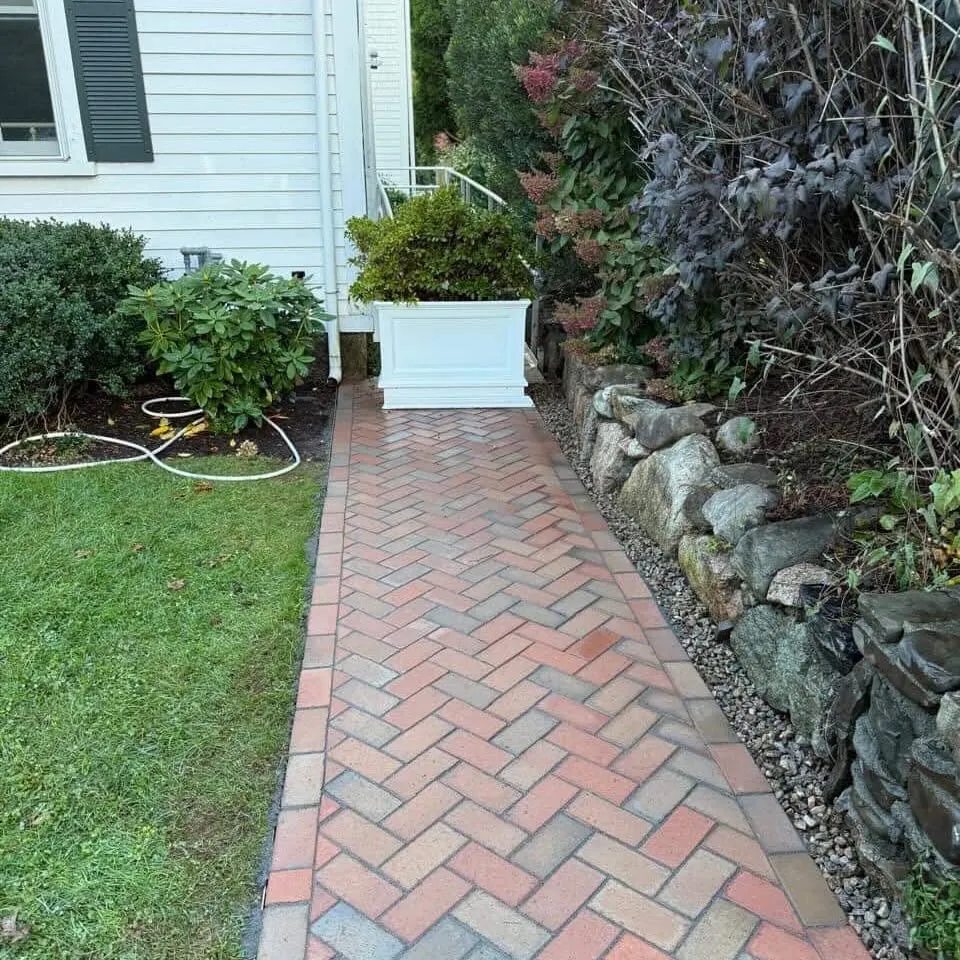 Paver side walkway with fieldstone retaining wall