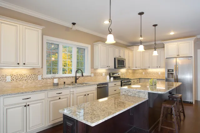 Finished white kitchen with pendant lighting