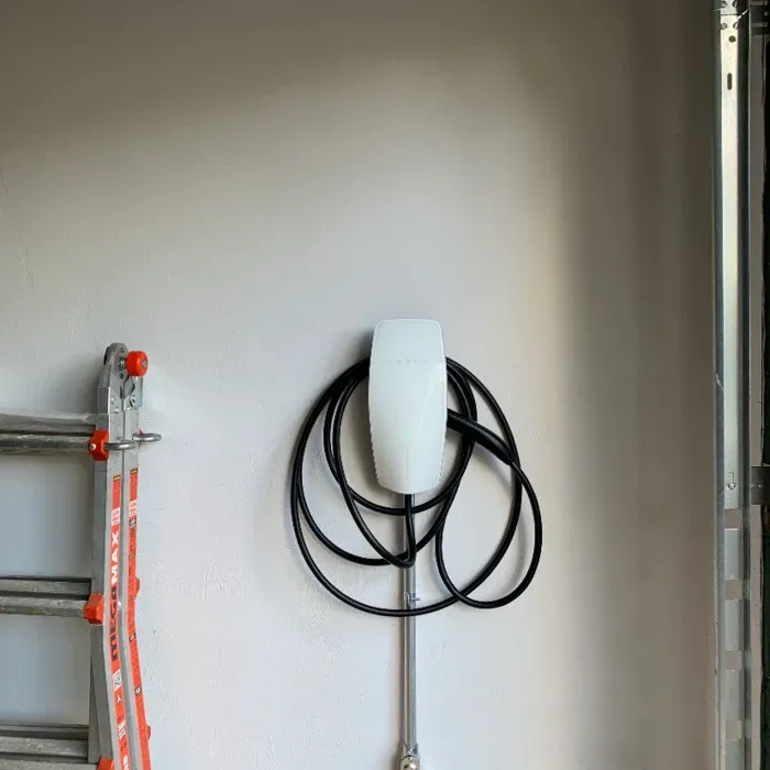 Tesla Wall Connector mounted in a garage