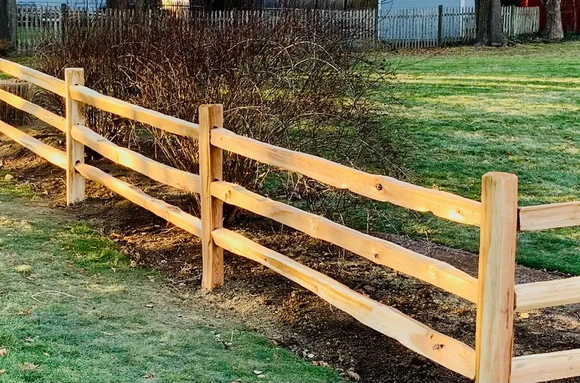Western Red Cedar split rail fence. Add welded wire to help keep pets and children safe