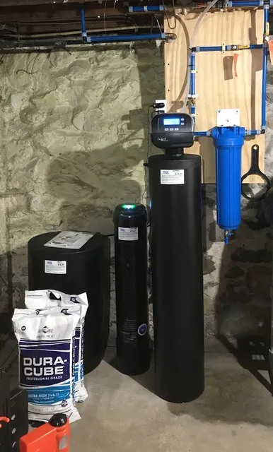 1 1/2 cubic feet Water Softener with PFAS removal system (shorter black tank with green illumination) and 20