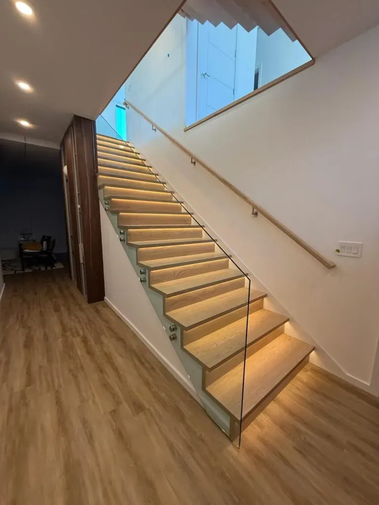 Glass railing installation on staircase