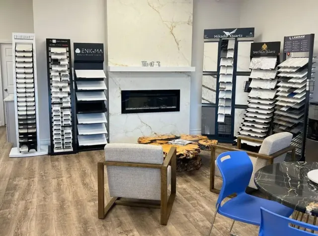 Tile showroom with displays, a fireplace, and seating.