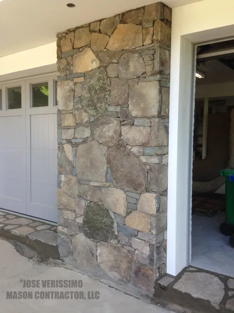 Stone Wall Veneer In Between Garage Doors