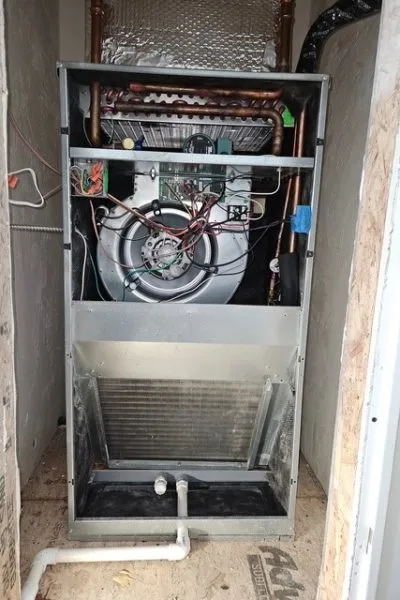 Exposed furnace air handler with blower wheel