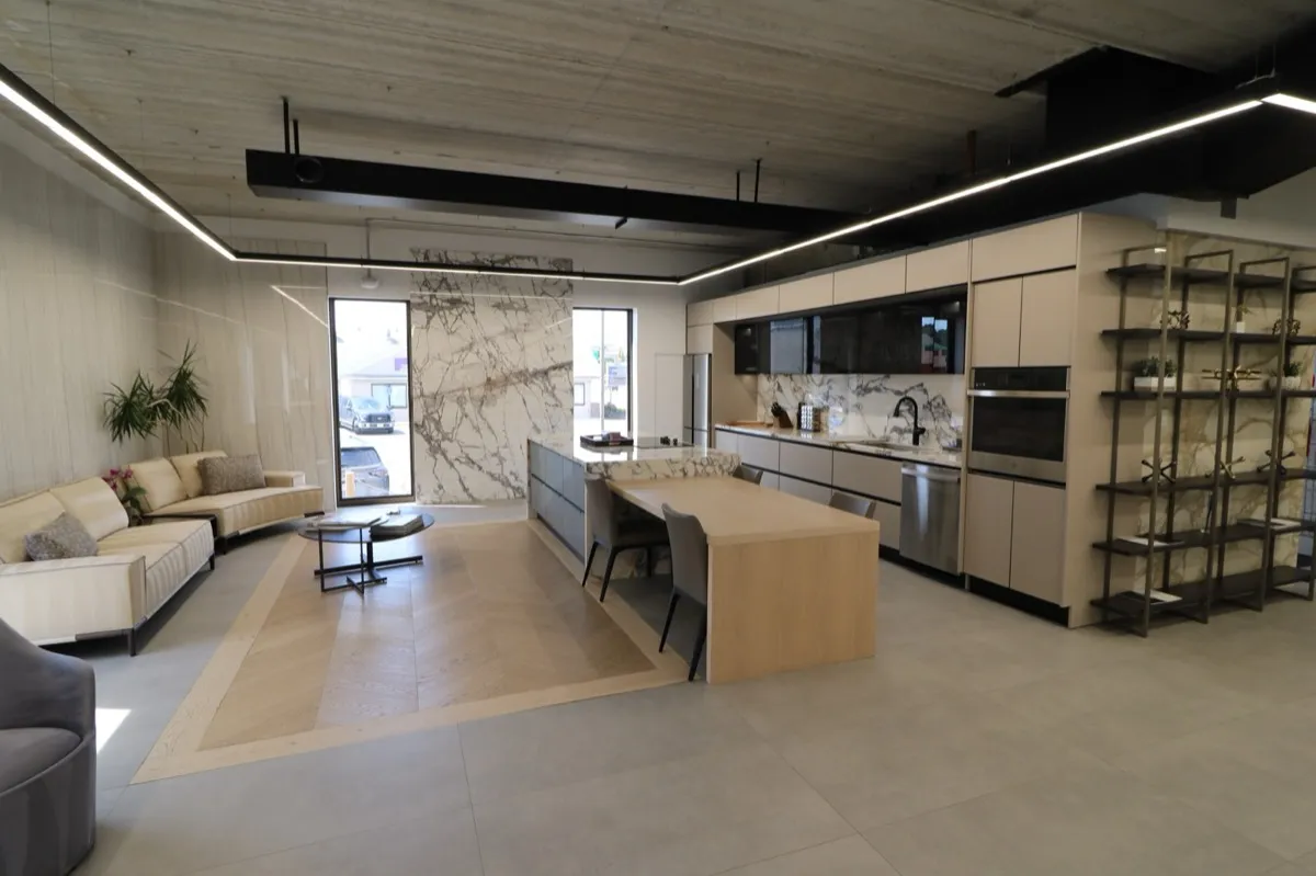 Ideal Tile of Newton — A refined showroom experience featuring marble surfaces and elegant kitchen vignettes