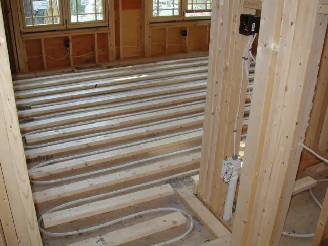 A wooden floor in a house under construction