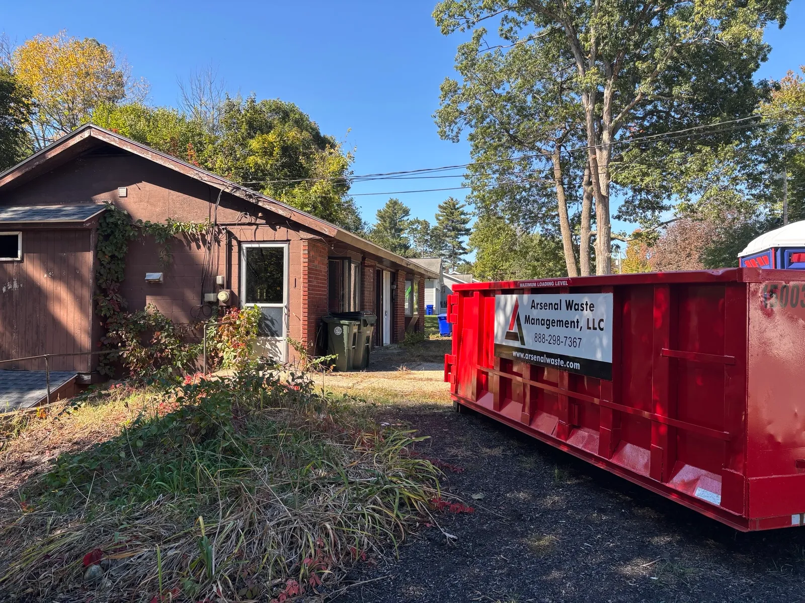 15 yard residential roll-off dumpster during a garage cleanout in Merrimack NH - Arsenal Waste Management