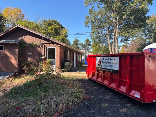 15 yard residential roll-off dumpster during a garage cleanout in Merrimack NH - Arsenal Waste Management