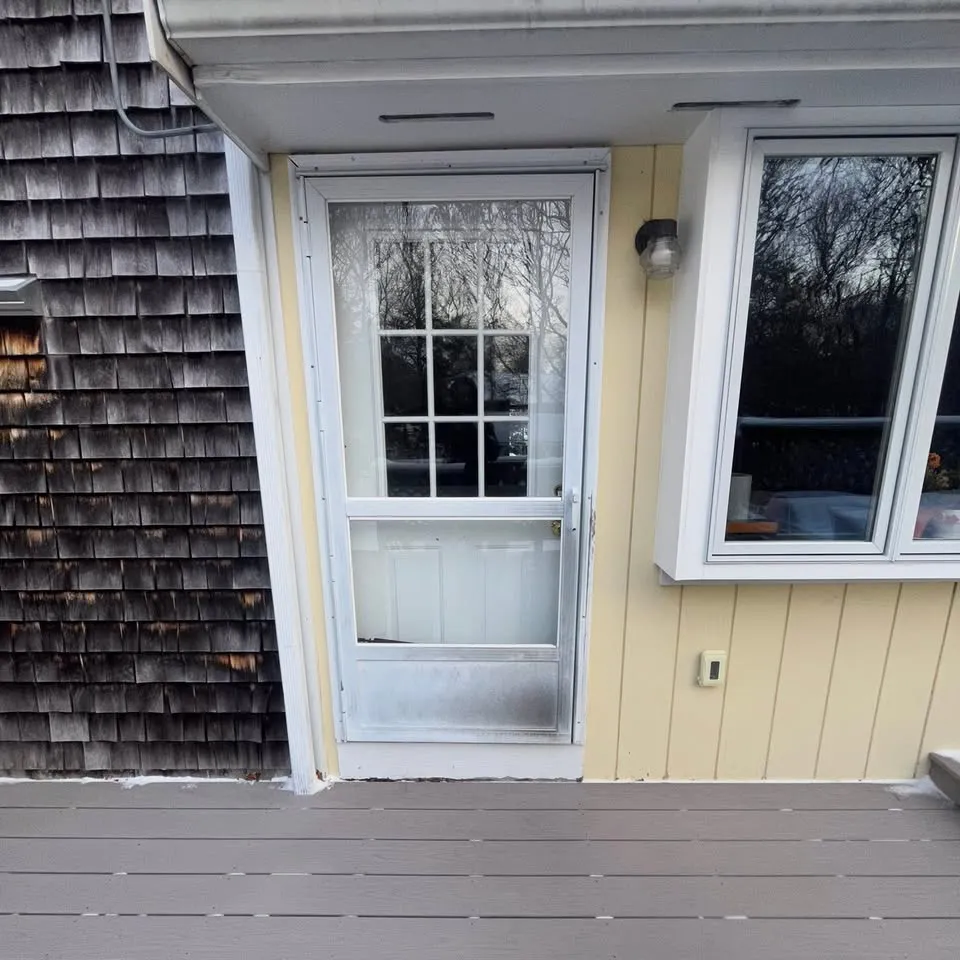 New exterior door and windows on a shingled home