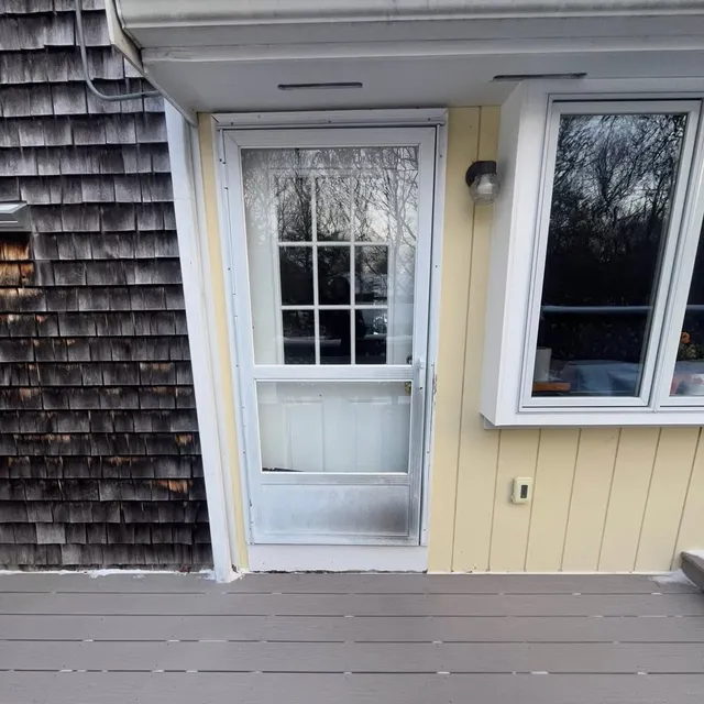 New exterior door and windows on a shingled home