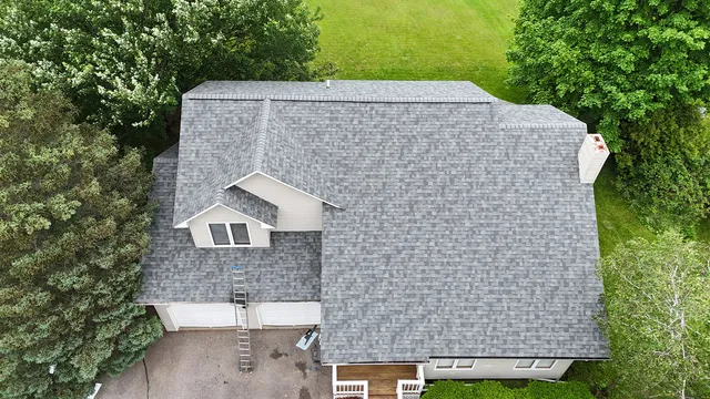 Completed Owens Corning shingle roof replacement on large residential home in Williston Vermont — aerial overhead view