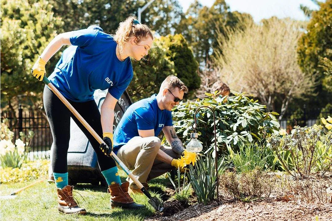 A man and woman gardening