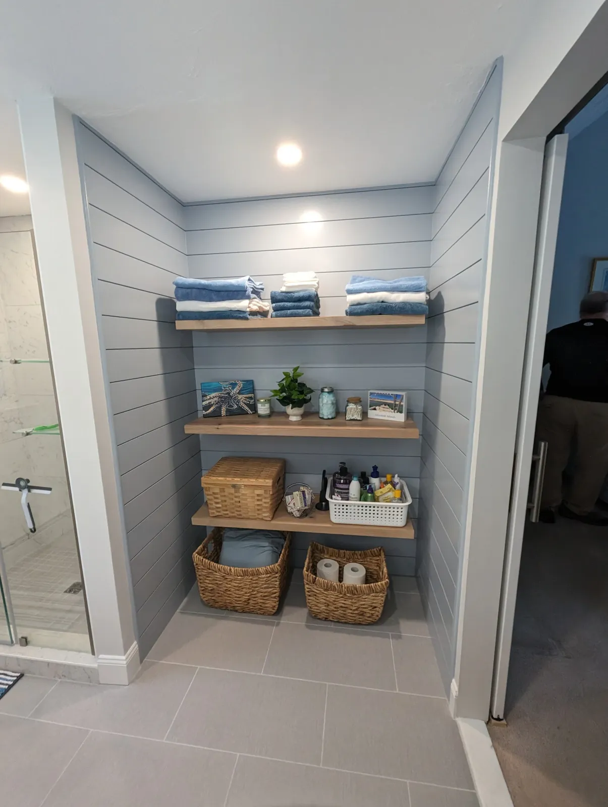 A modern looking shiplap alcove in a bathroom in Lakeville, remodeled from a closet and turned into open shelving