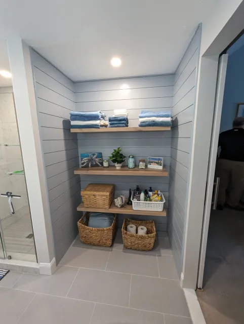 A modern looking shiplap alcove in a bathroom in Lakeville, remodeled from a closet and turned into open shelving