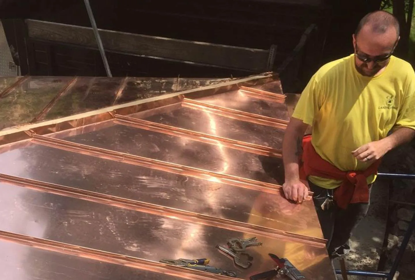 A repairman with a copper roof.