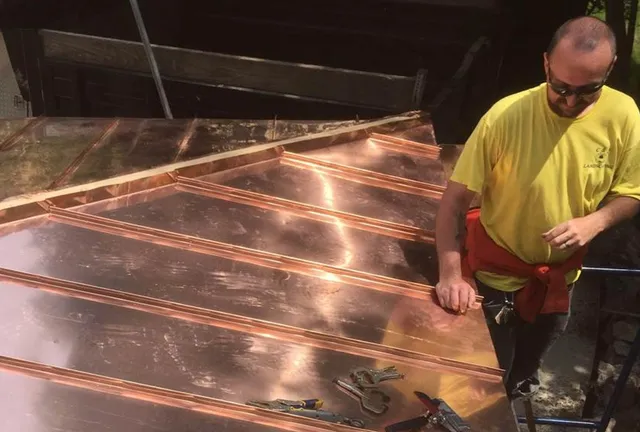 A repairman with a copper roof.