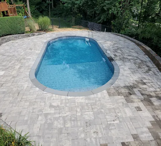 Paver pool deck and coping installed by Three Guys Masonry in Connecticut