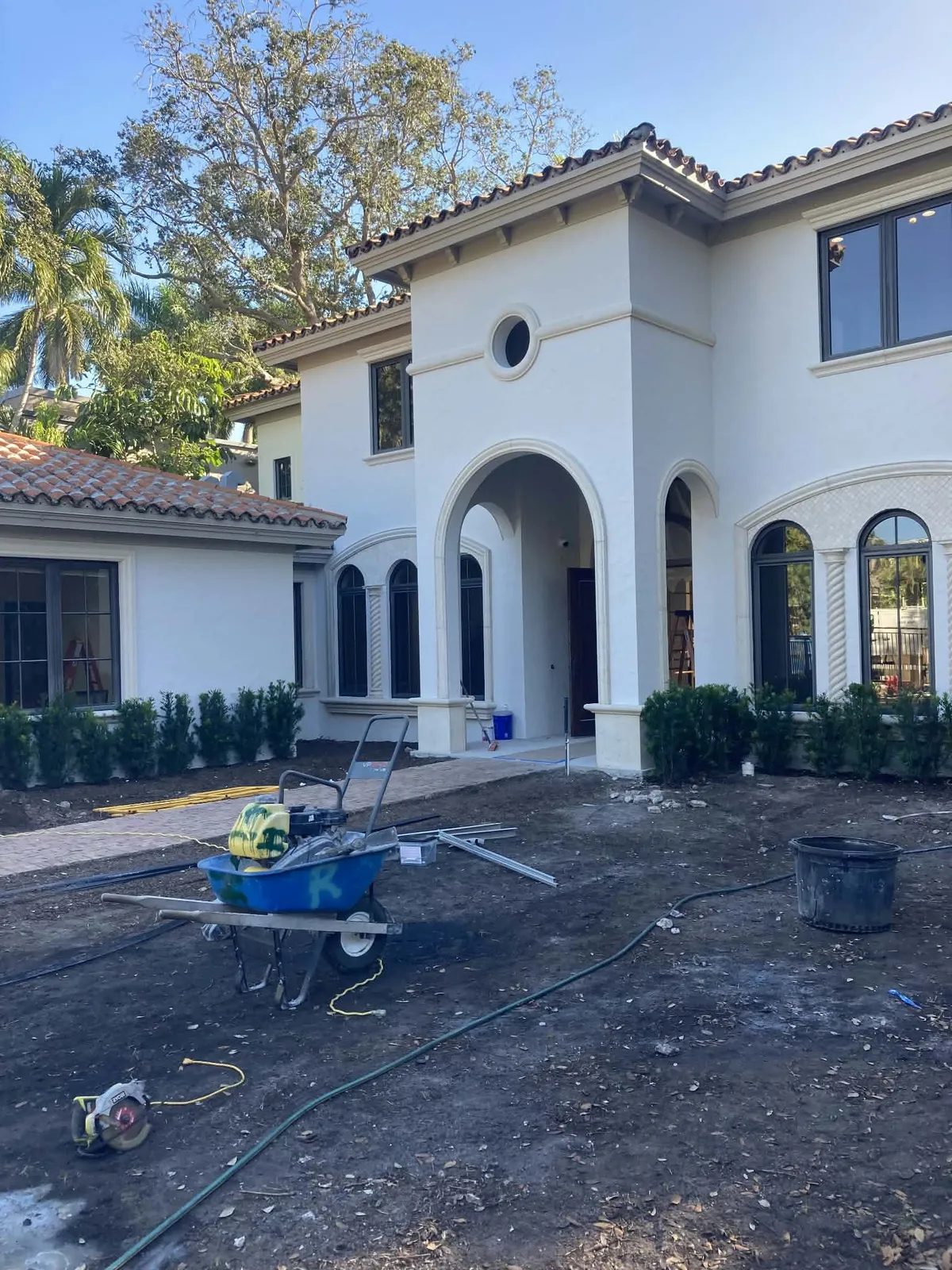 Exterior repaint prep on a large stucco residence.