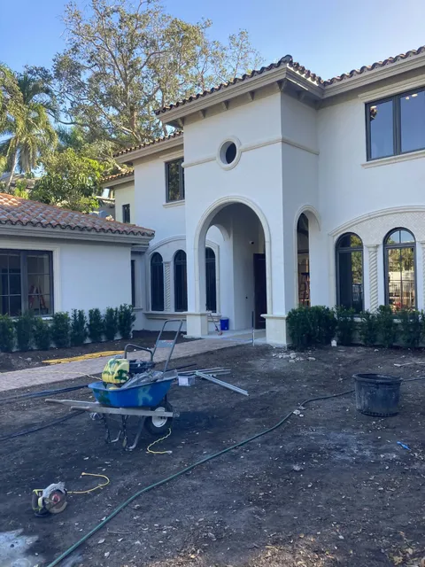 Exterior repaint prep on a large stucco residence.