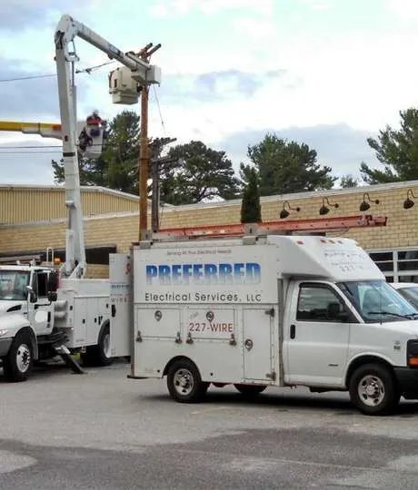 Preferred Electrical Services, LLC team performing professional outdoor electrical work with service vehicles on-site