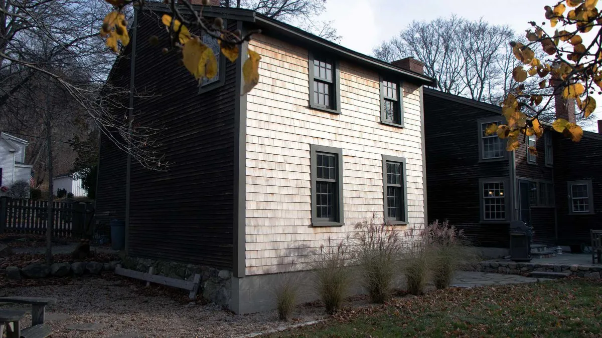 An exterior view - Joset shored up an existing antique addition on this Ipswich property, requiring a hand-dug foundation and hidden steel reinforcement.