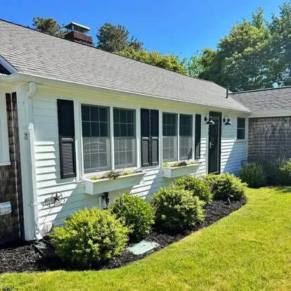 Fresh black mulch around a home