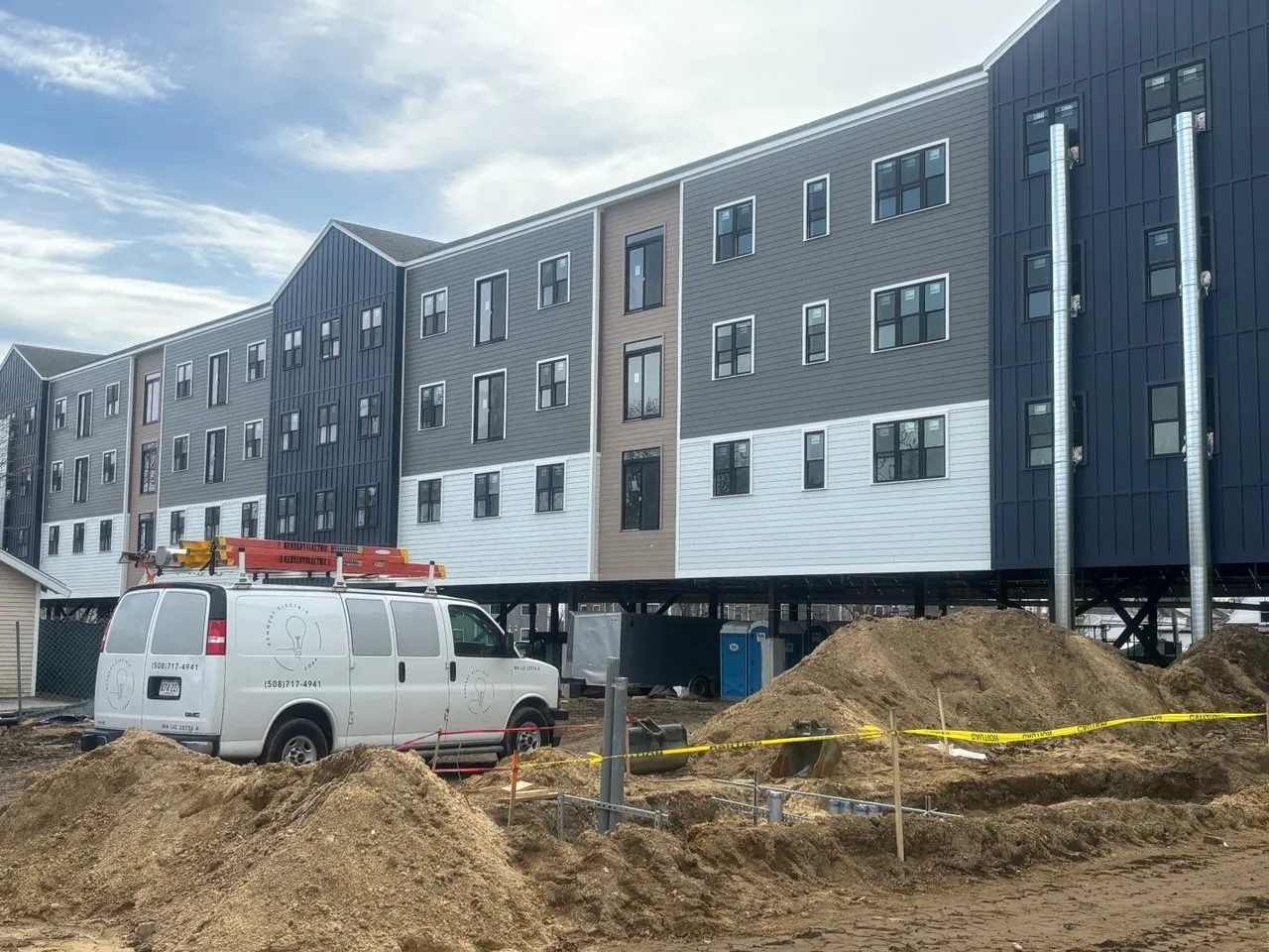Hyannis Lofts exterior — four-story mixed-use building in progress