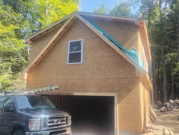 Two-Story Garage & Log Steel Siding