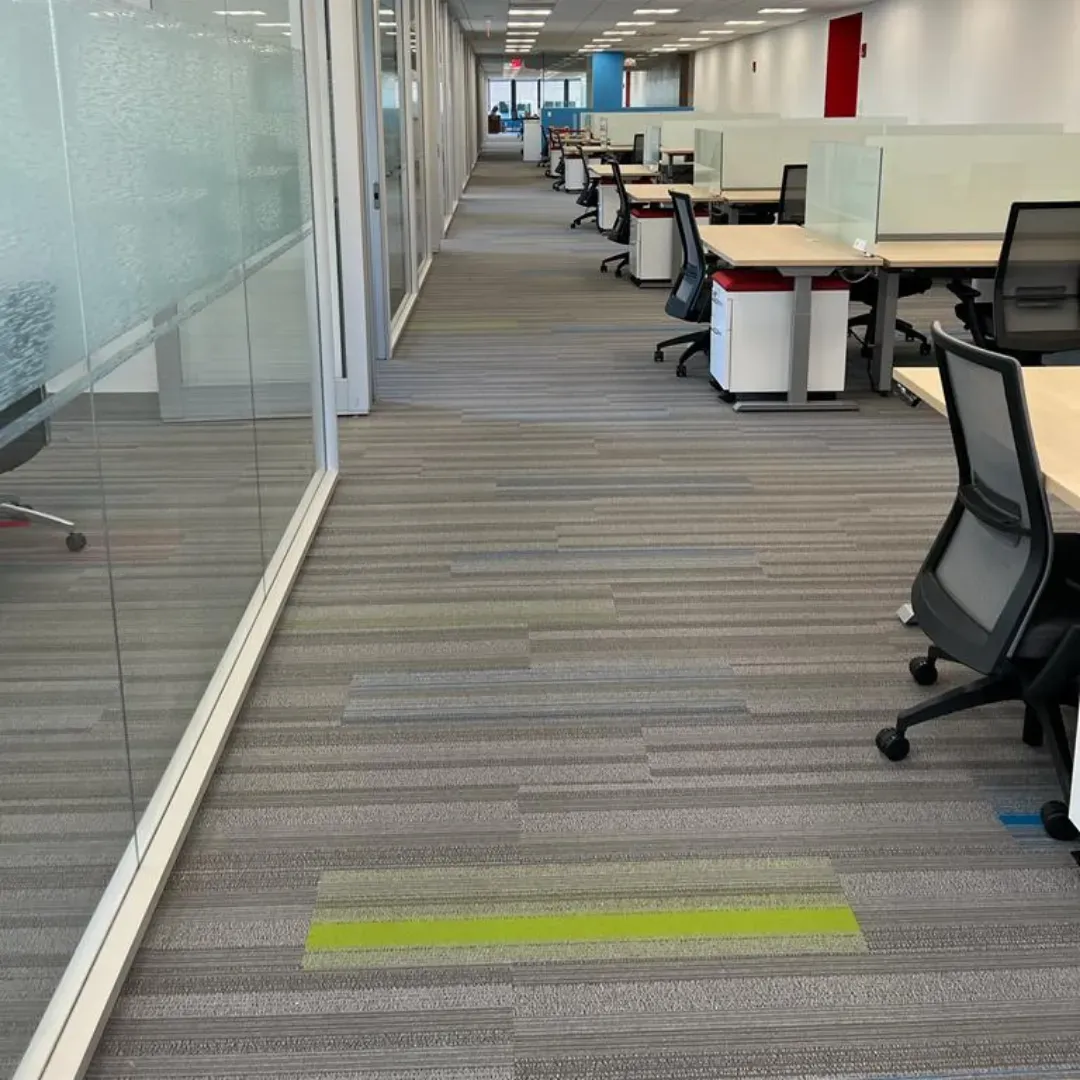 Commercial gray carpet tile flooring with green accent in open office by Link Services Pro in Auburn, MA