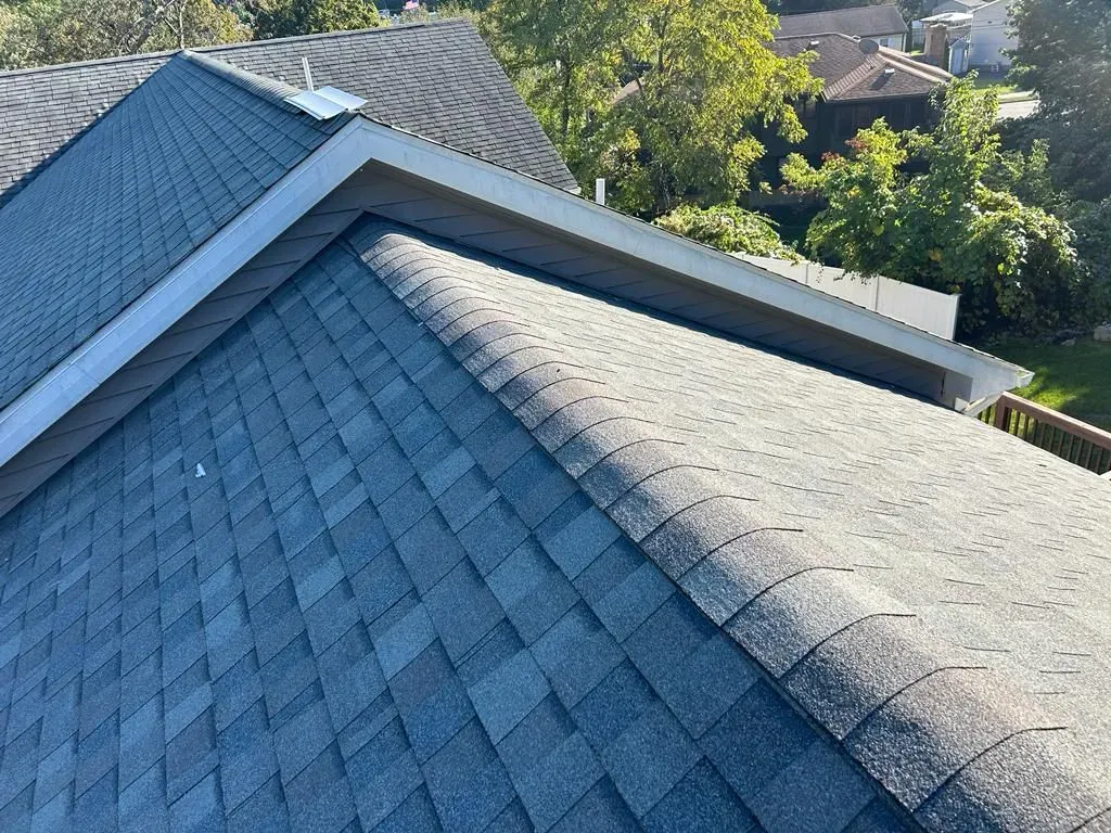 A close-up of a roof with a lot of shingles on it.