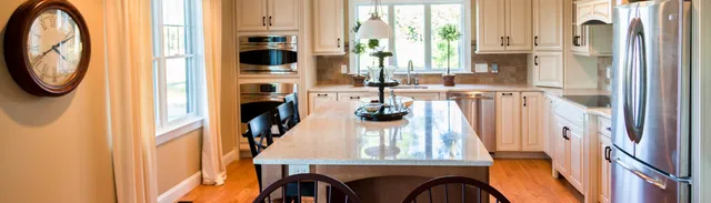 interior view of a luxury kitchen with island and a farmer's table
