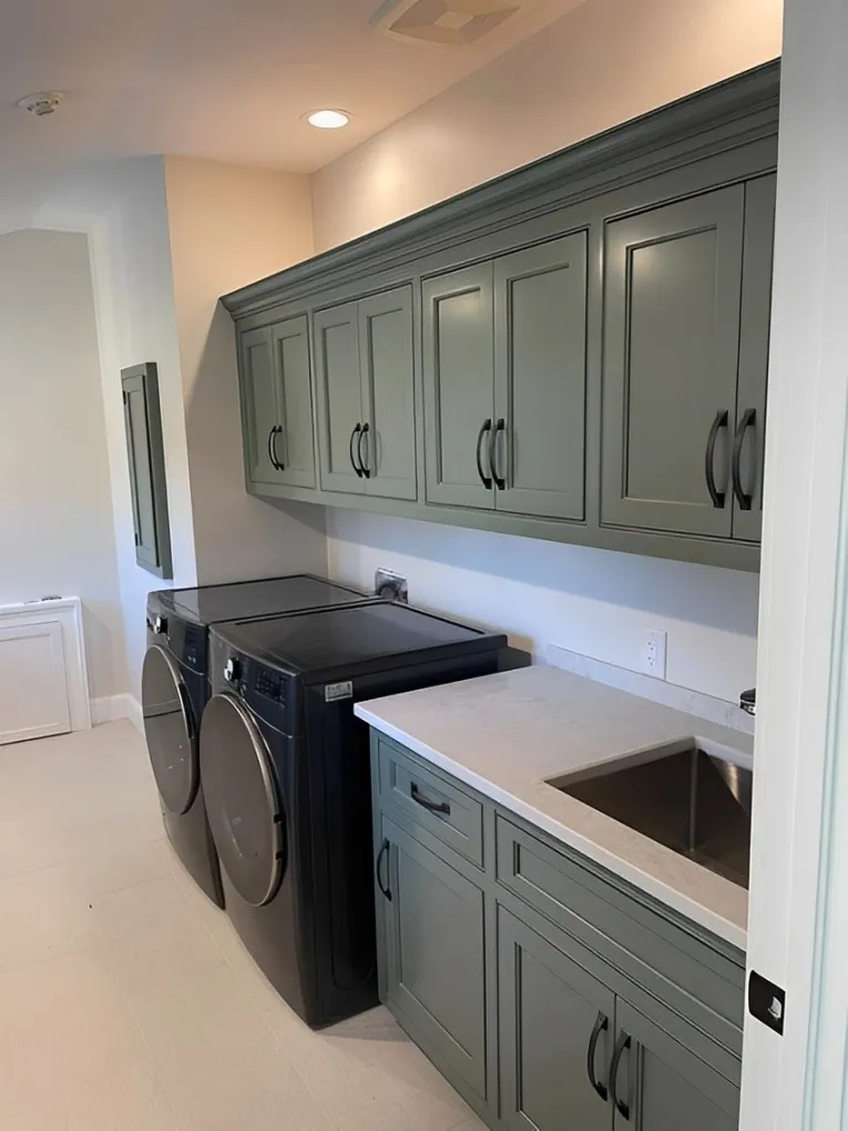 A Tidy Laundry Room Featuring A Modern Washer And Dryer, Organized For Efficient Laundry Tasks.