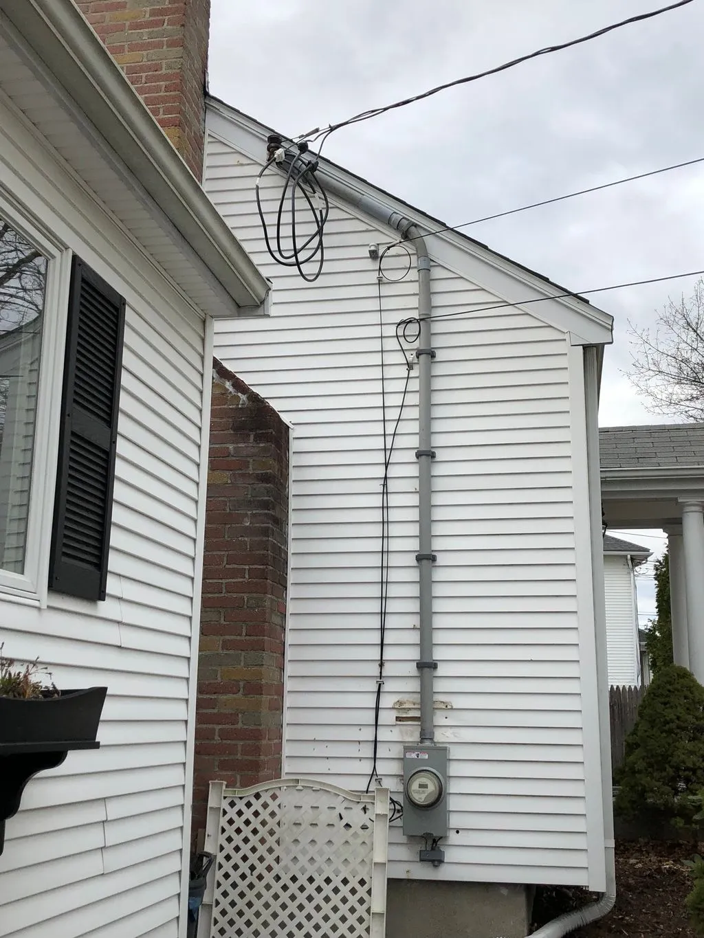 Service mast, weatherhead and meter socket