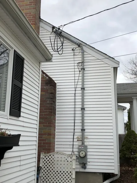 Service mast, weatherhead and meter socket