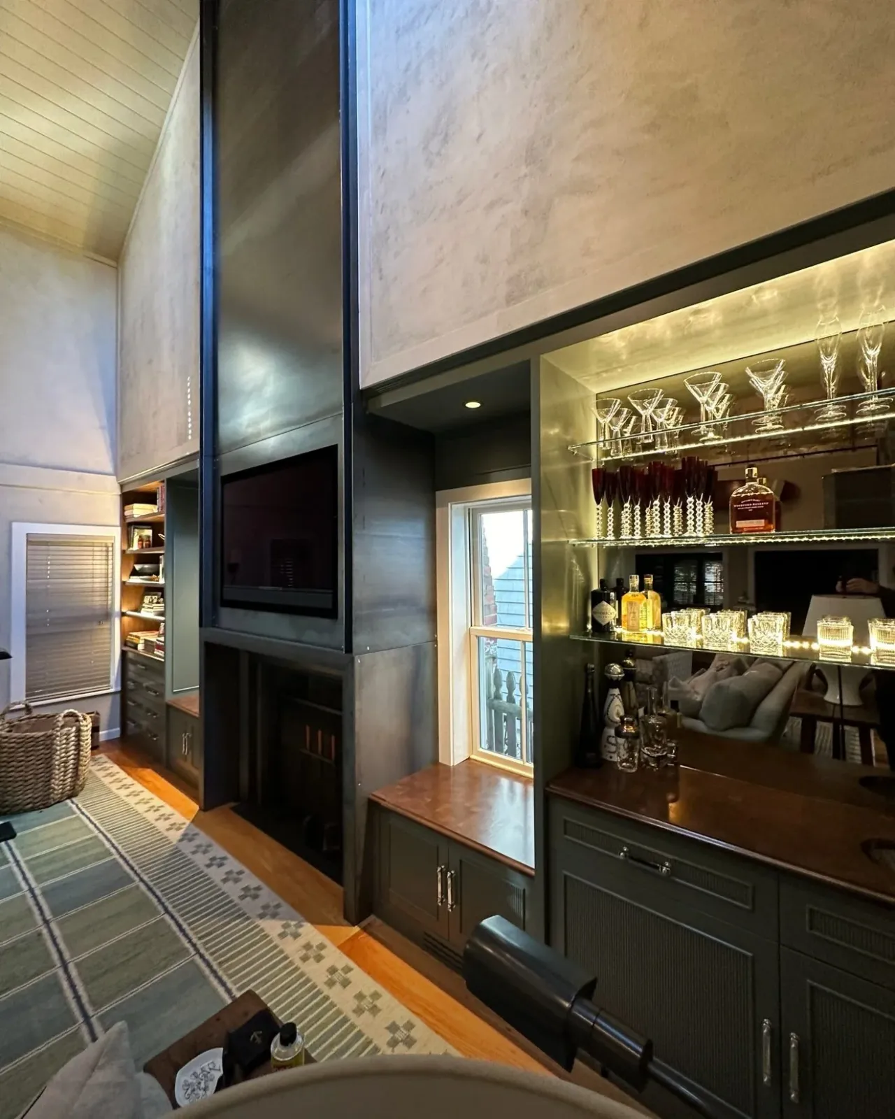 Renovation with steel accents, custom cabinets, and more