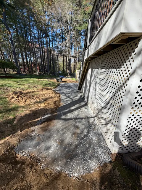 Base preparation extended along the connecting walkway during Bellingham Massachusetts patio project