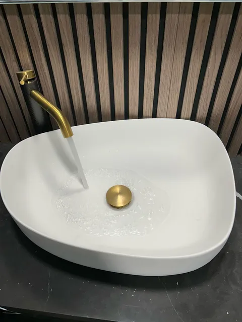 Finished vessel sink and faucet installation