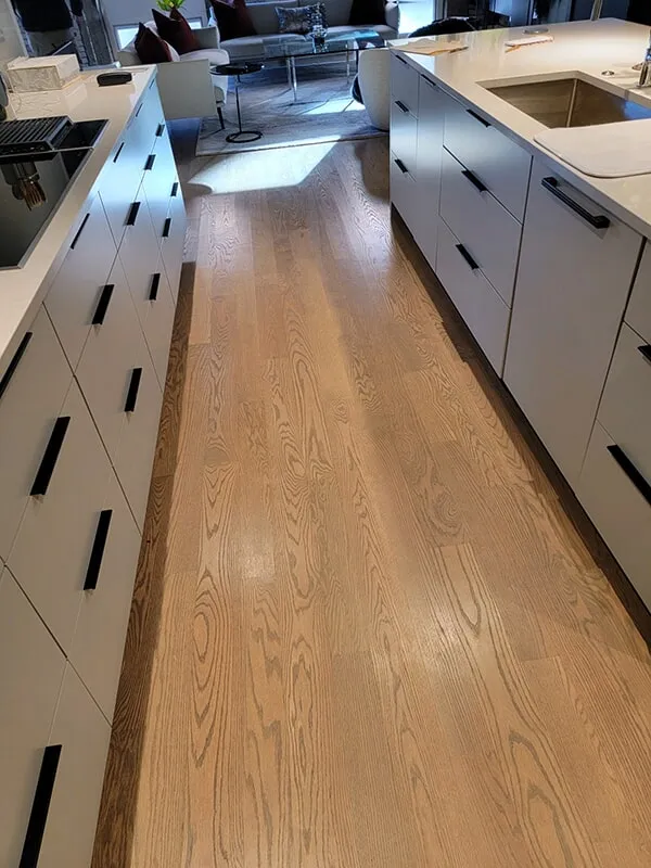 Light hardwood floors in kitchen in Ashland, MA