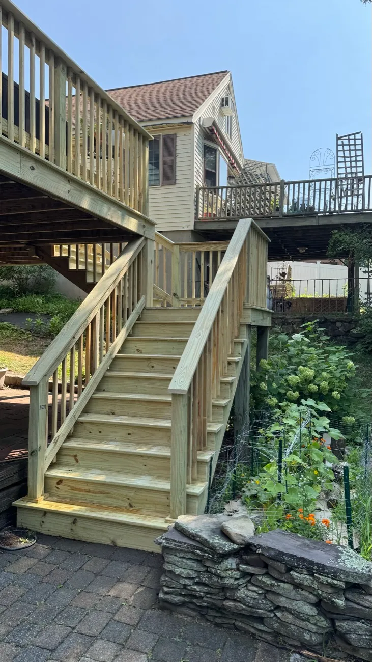 New pressure-treated two-flight exterior staircase