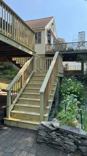 New pressure-treated two-flight exterior staircase