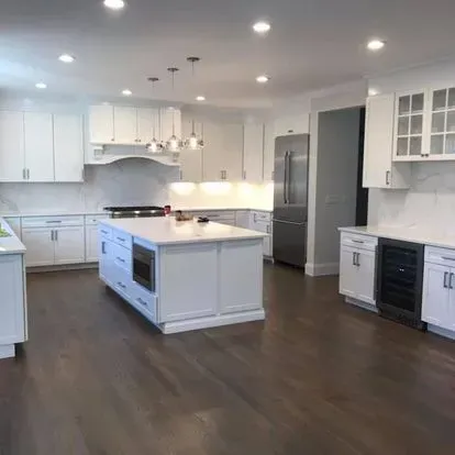 There is a large island in the middle of the kitchen.